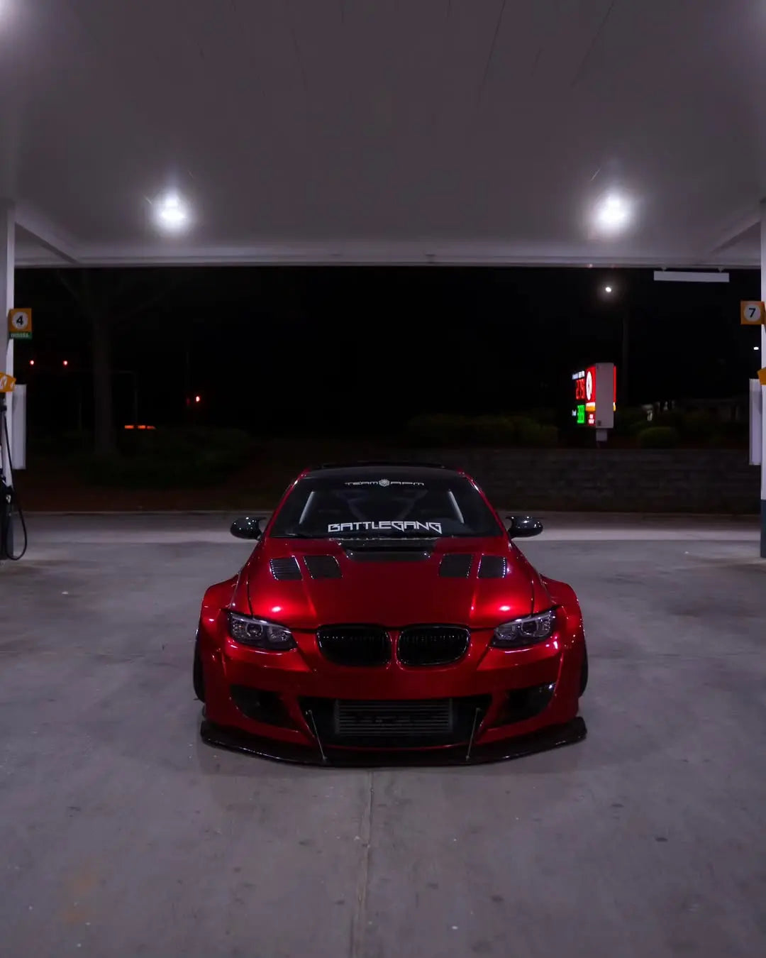 Front view of a widebody BMW 3 Series (E92) coupe wrapped in Glossy Metallic Vampire Red - Kaleido