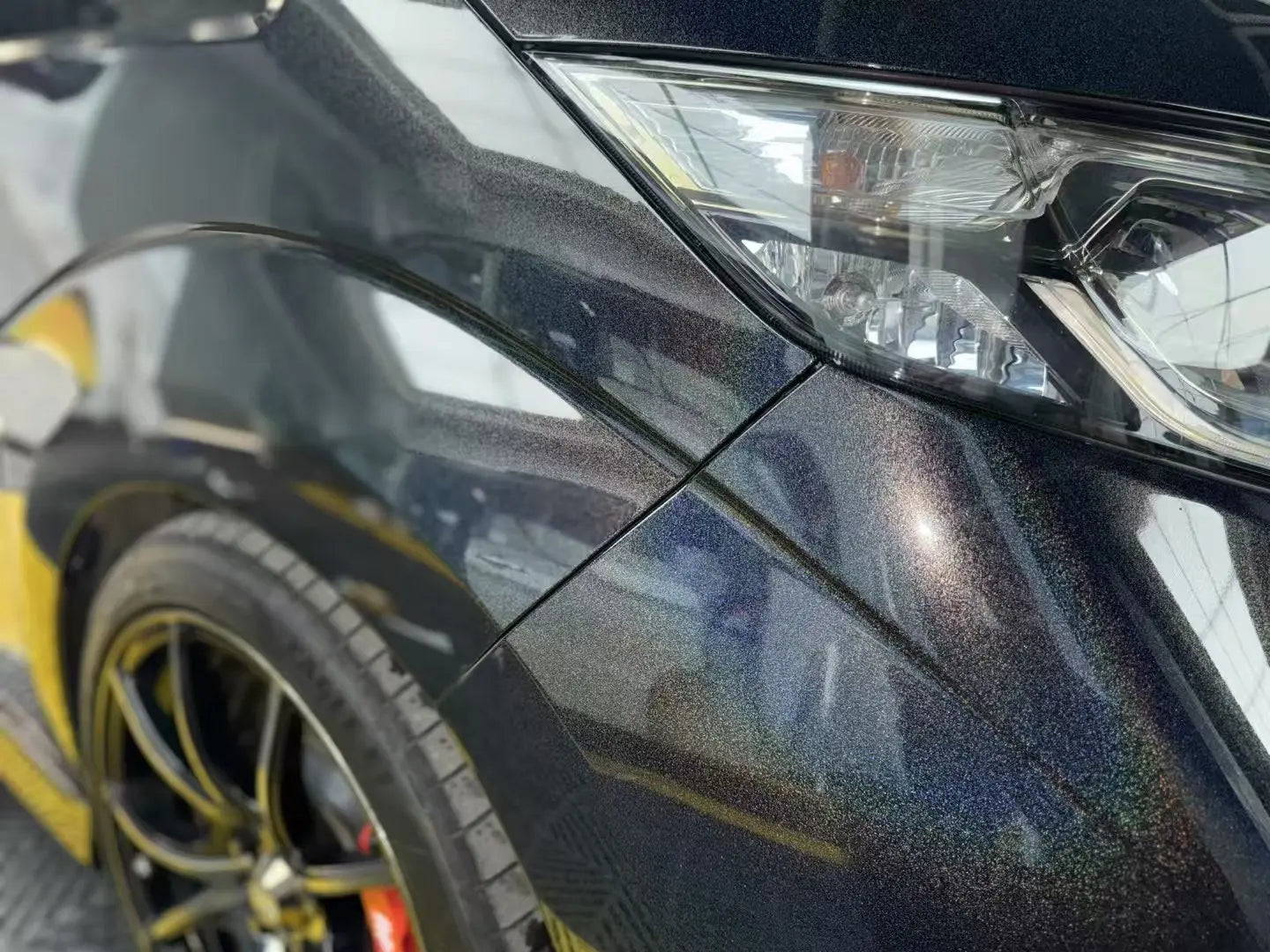 Laser Gloss Black film on Honda Odyssey rear quarter panel - holographic detail - Kaleido
