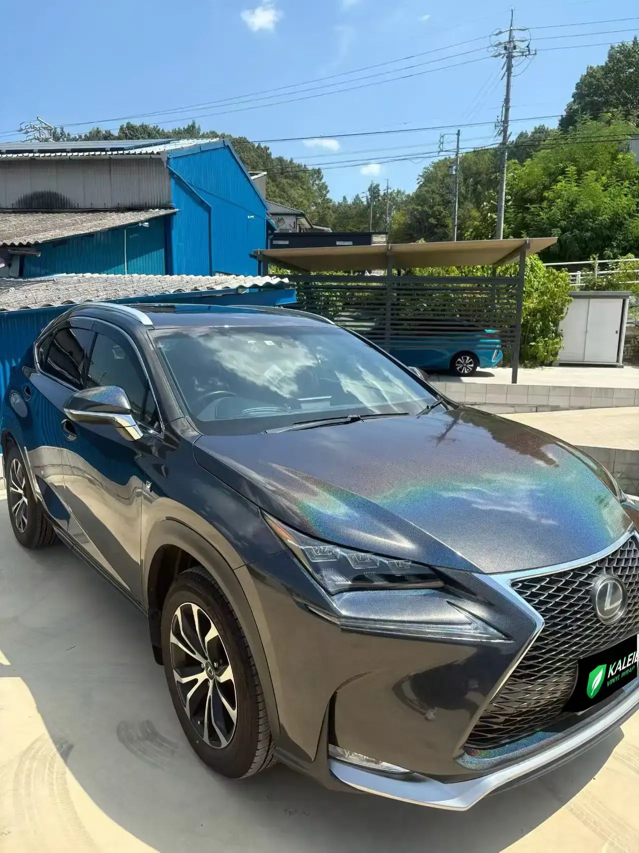 Lexus NX in Laser Gloss Black vinyl - front-right color shift view - Kaleido