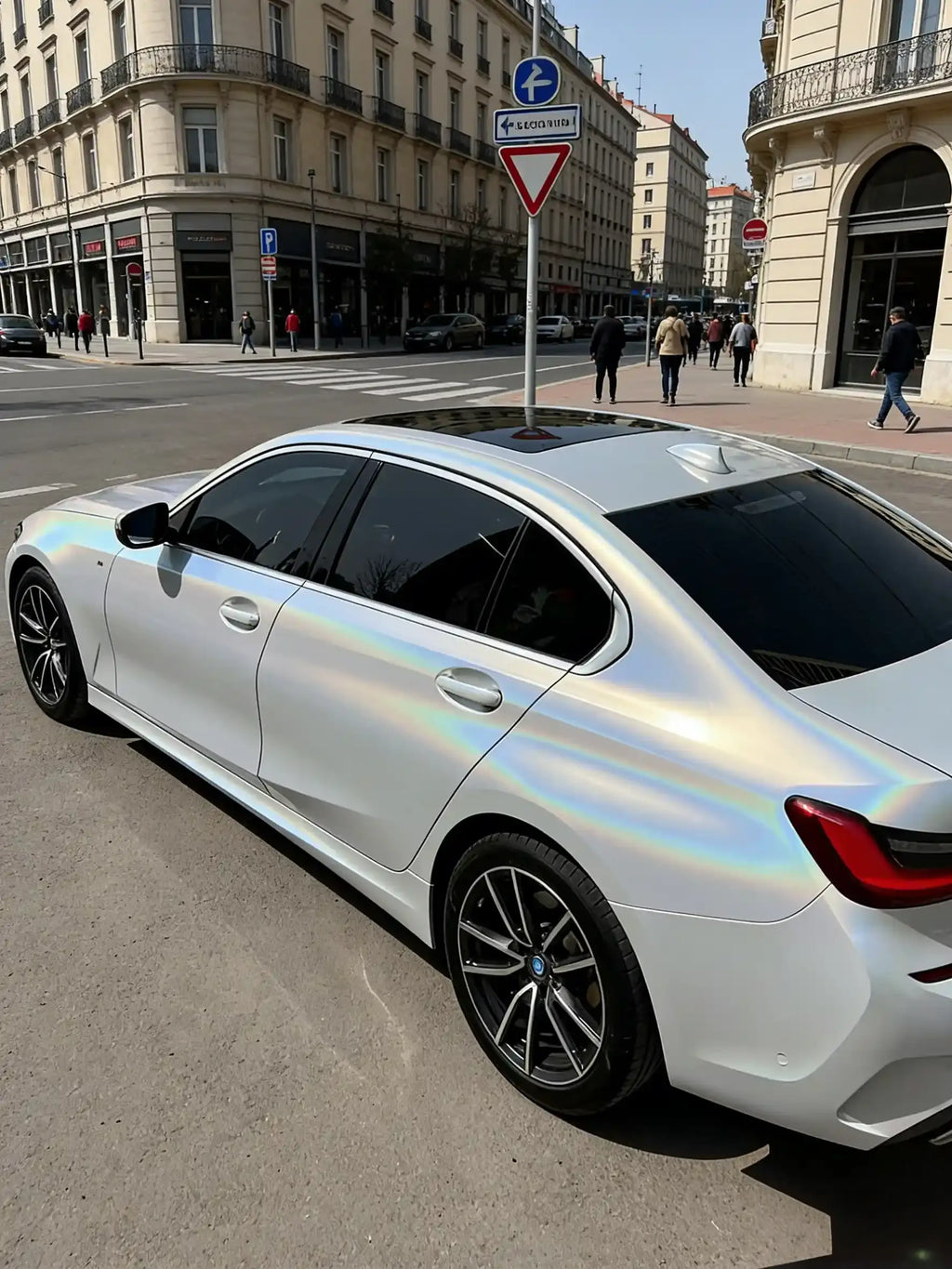 Wide rear-left view of Laser Gloss Prismatic White wrapped BMW 3 Series - Kaleido