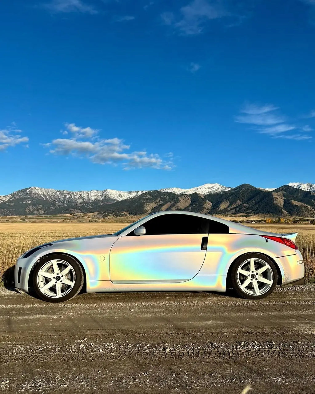 Nissan 350Z in Laser Gloss Prismatic White vinyl - side profile showing rainbow spectrum - Kaleido