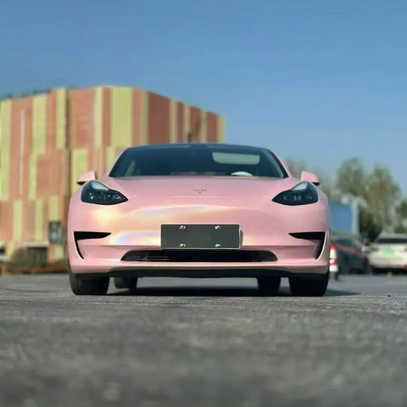Front view of Tesla Model 3 in Laser Gloss Rouge Pink laser vinyl - Kaleido