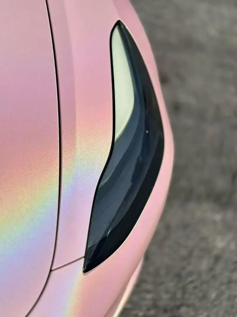 Close-up of Laser Gloss Rouge Pink wrap on Tesla Model 3 left headlight - precise installation - Kaleido