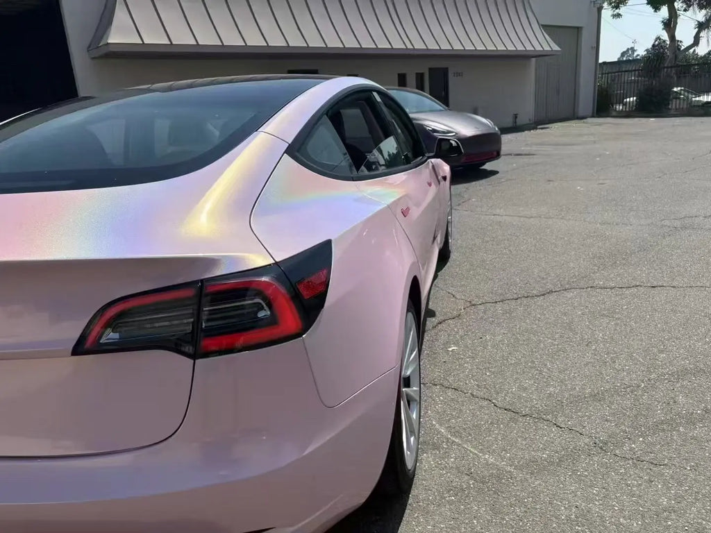 Laser Gloss Rouge Pink vinyl on Tesla Model 3 right rear side - rainbow reflection - Kaleido