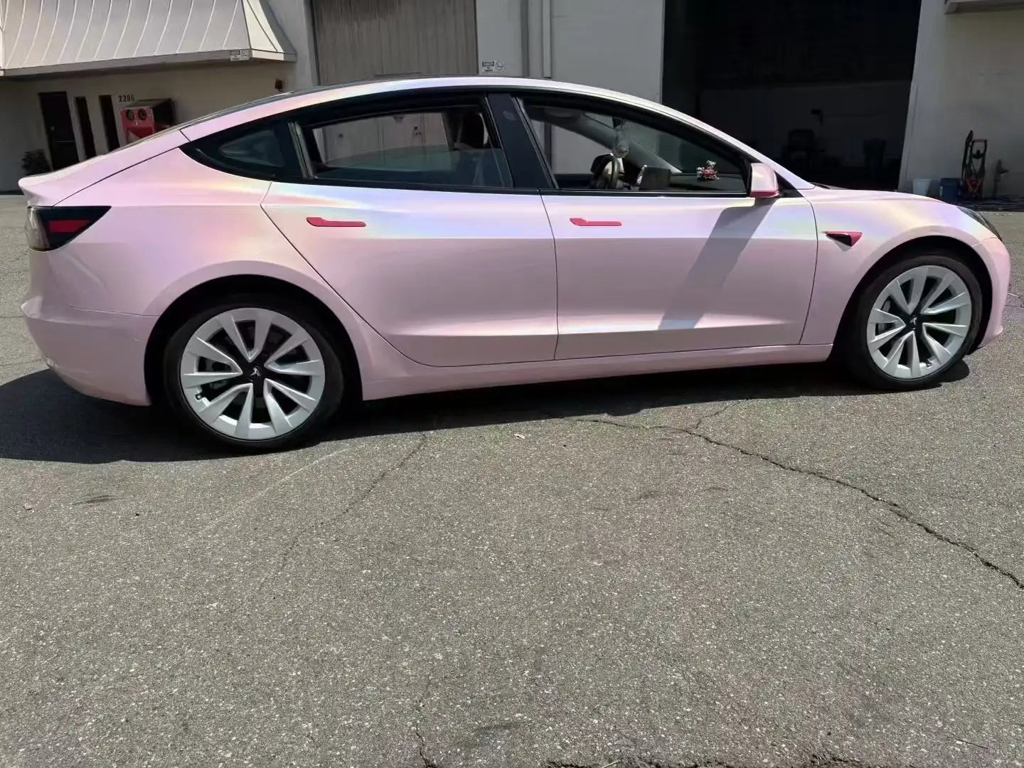 Tesla Model 3 in Laser Gloss Rouge Pink - right side holographic profile - Kaleido