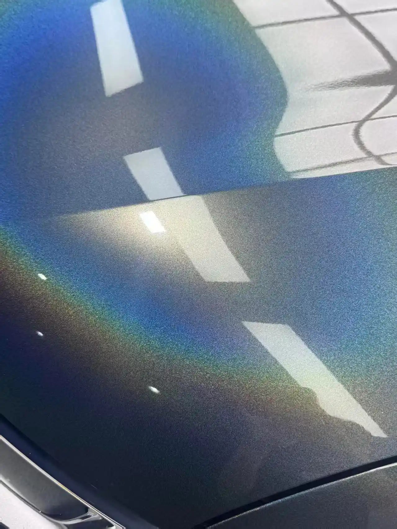Macro detail of Laser Holographic Gray film on Roewe RX8 hood panel - color shift texture - Kaleido