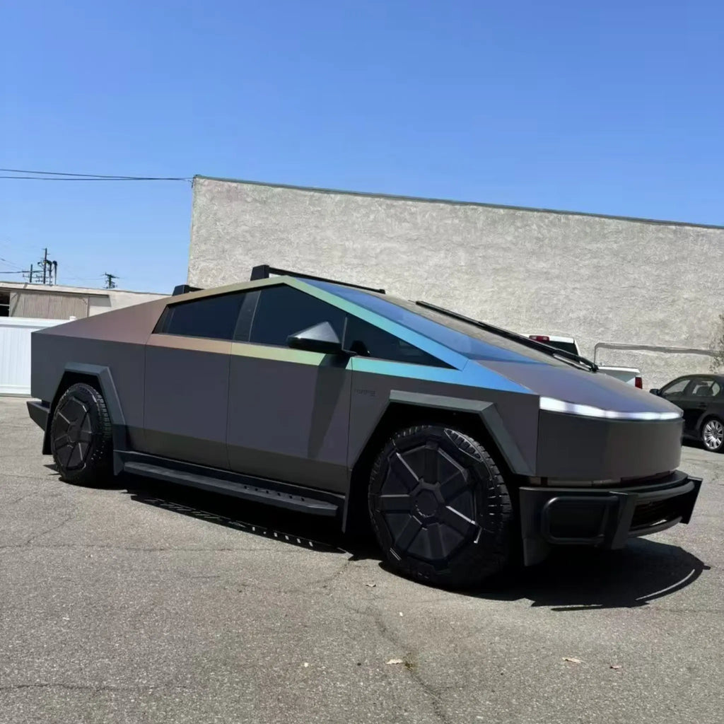Laser Satin Gray film on Tesla Cybertruck - front-right view highlighting angular body and holographic rainbow - Kaleido