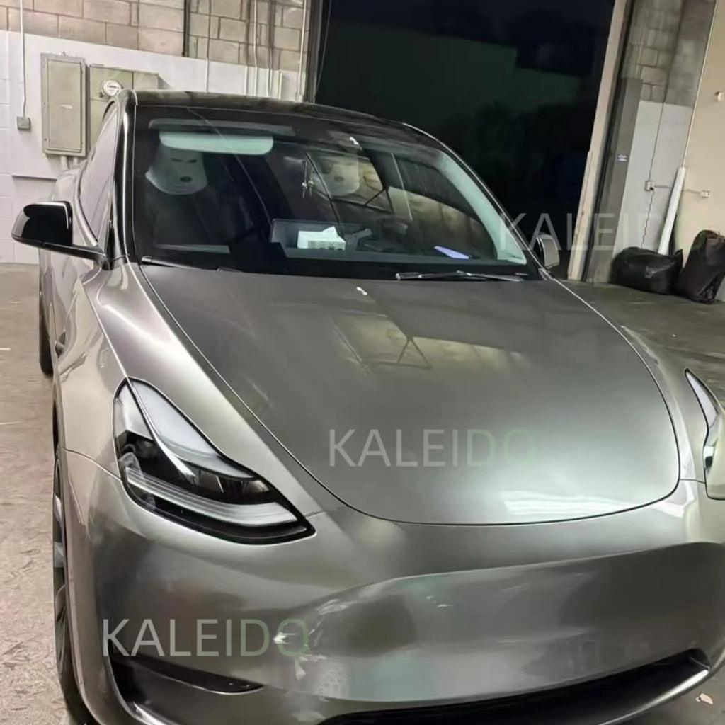 Close-up front view of Tesla Model Y with Liquid Silver gloss metallic film - Kaleido