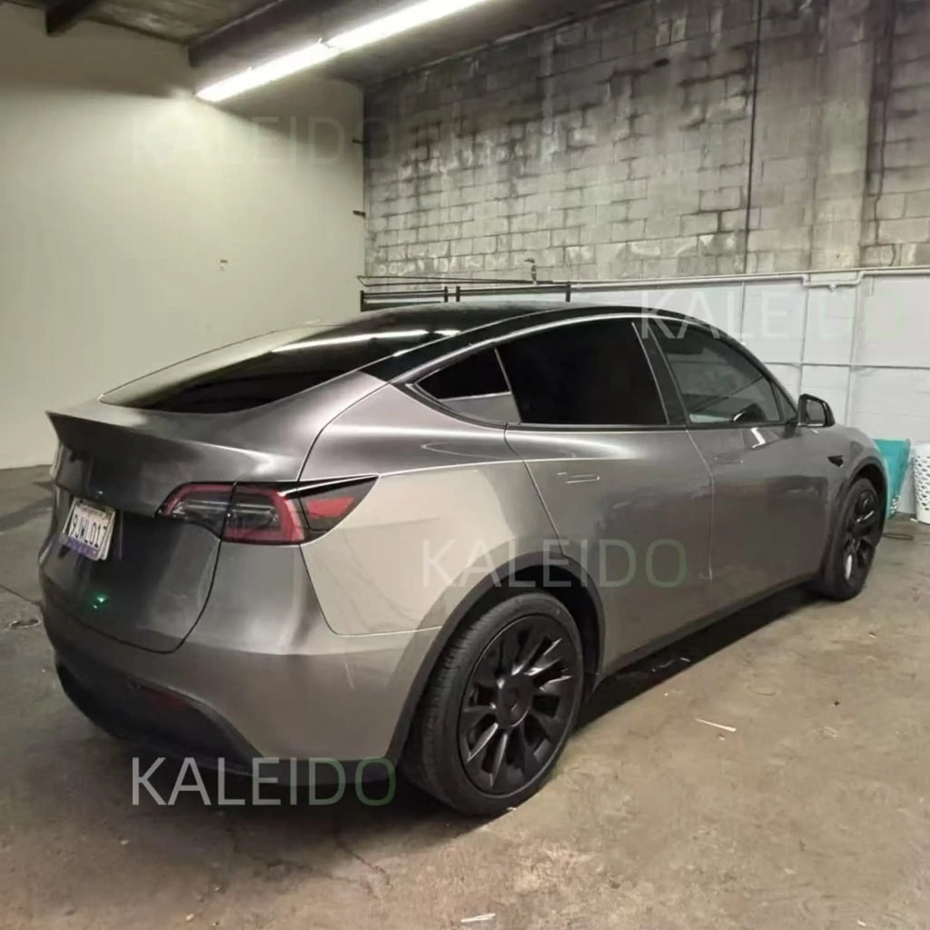 Liquid Silver gloss metallic wrap on Tesla Model Y - rear-right view of the SUV - Kaleido
