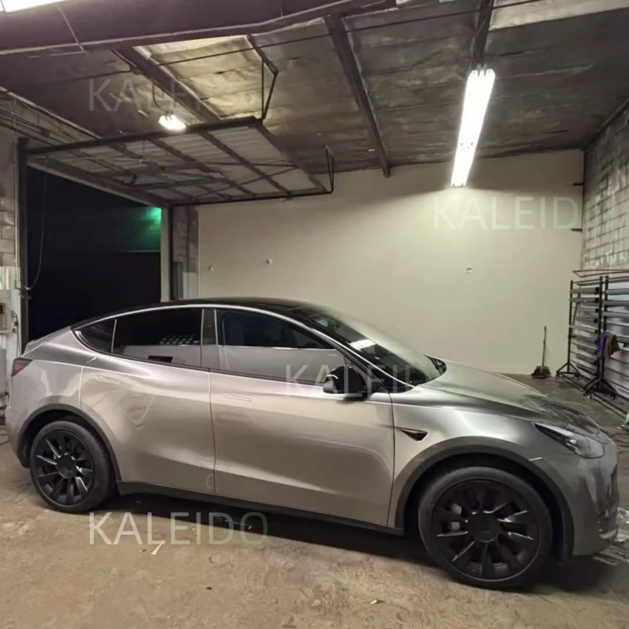 Full right side profile of Tesla Model Y in Liquid Silver vinyl wrap - Kaleido