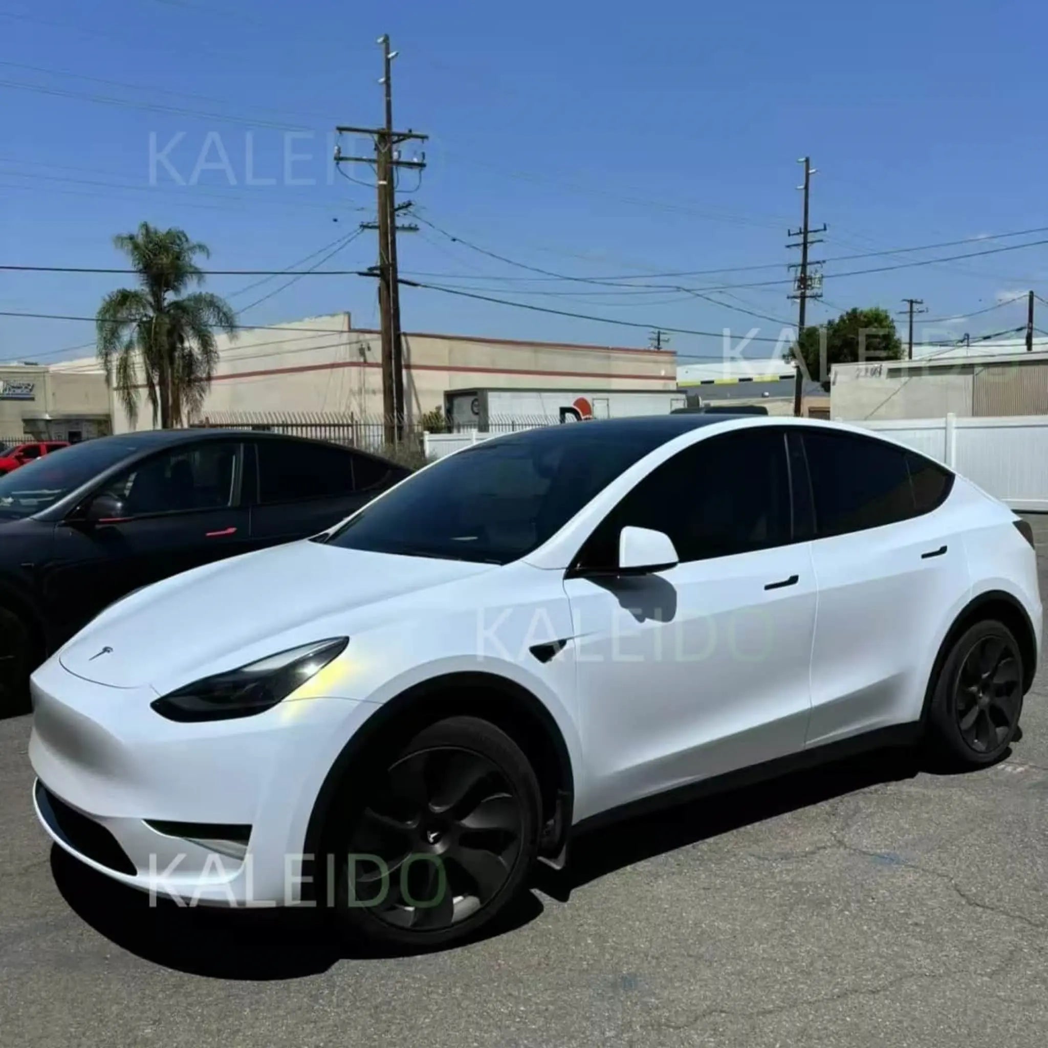Matte Diamond Iridescent White Gold wrap on Tesla Model 3 - front-left angle showcasing matte pearl finish - Kaleido