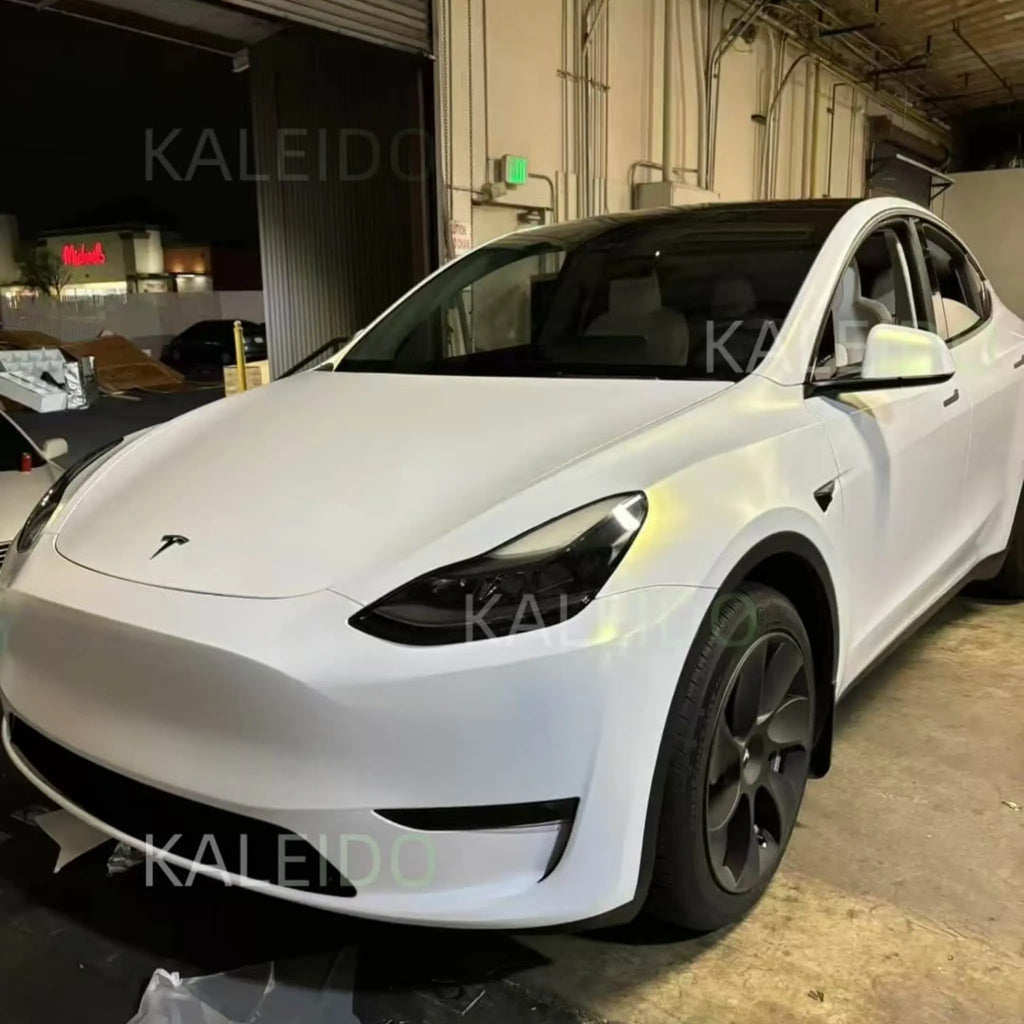 Matte Diamond Iridescent White Gold vinyl on Tesla Model Y - front-left angle - Kaleido