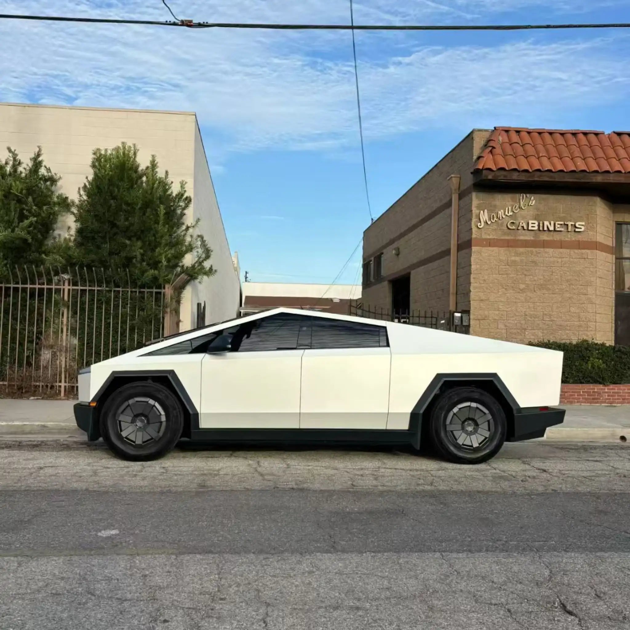 Full left side profile of Tesla Cybertruck in Matte Lunar White matte wrap - Kaleido