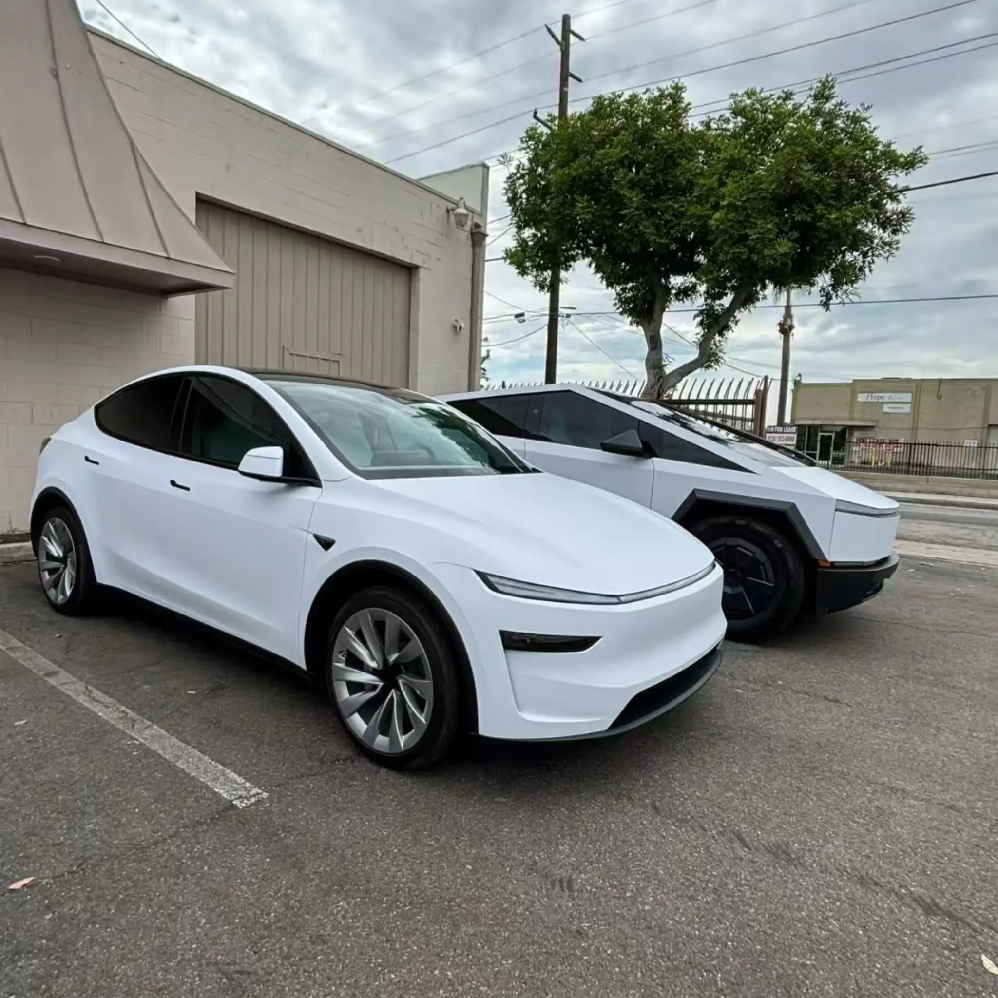 Tesla Model Y in Matte Lunar White vinyl - front-right angle showing clean matte finish - Kaleido