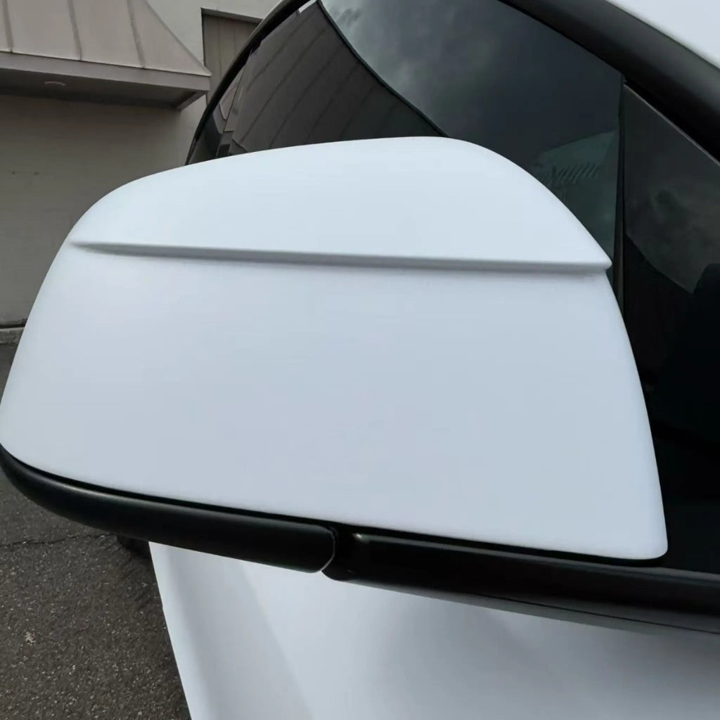 Macro detail of Matte Lunar White film on Tesla Model Y side mirror - Kaleido