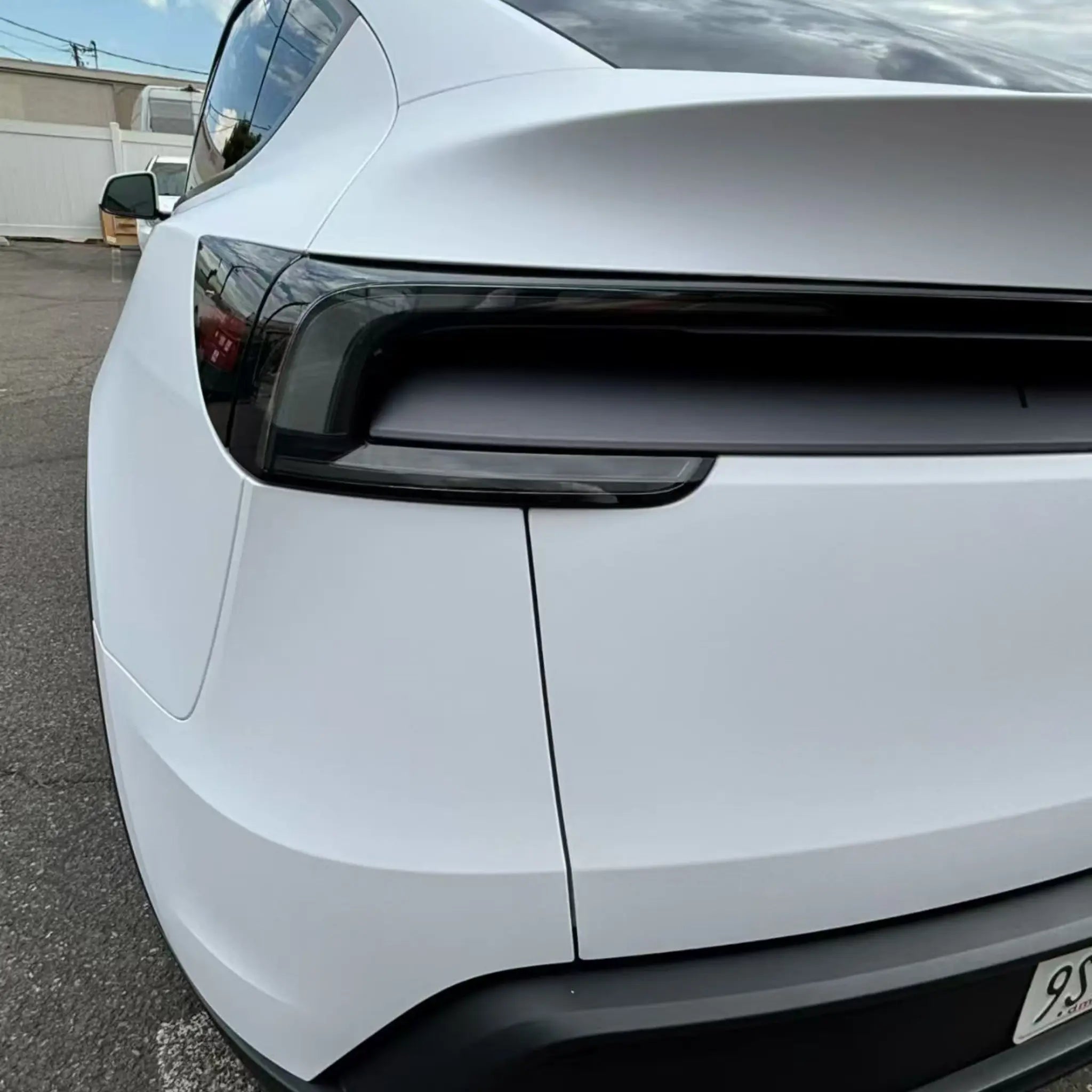 Tesla Model Y with Matte Lunar White wrap - rear-left corner detail - Kaleido