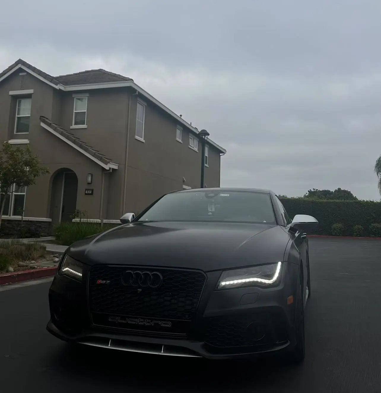 Audi RS7 in Silky Noir matte vinyl - front-left view in overcast conditions showing soft satin sheen - Kaleido