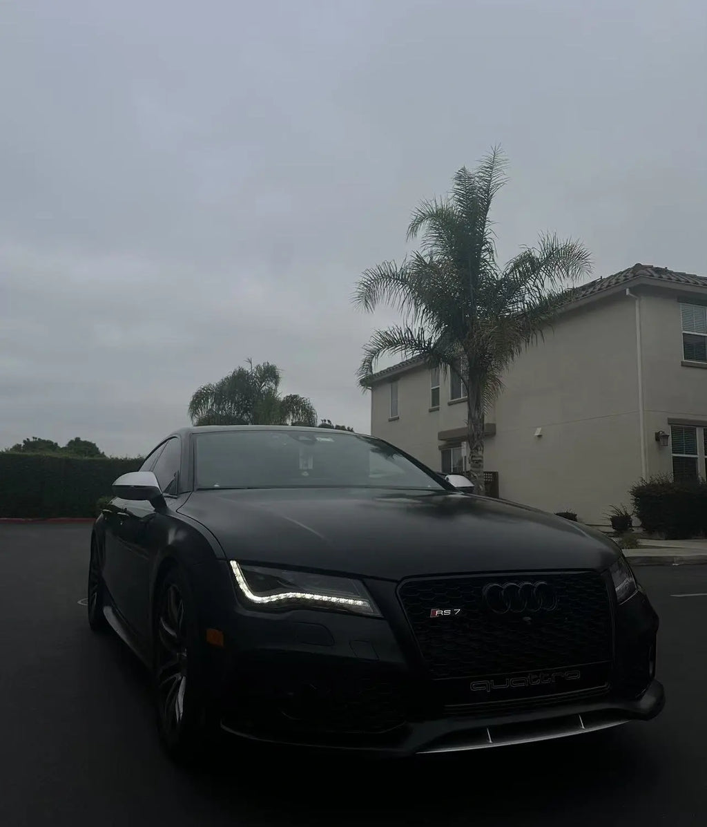 Silky Noir matte wrap on Audi RS7 front-right - cloudy weather highlighting silk texture - Kaleido