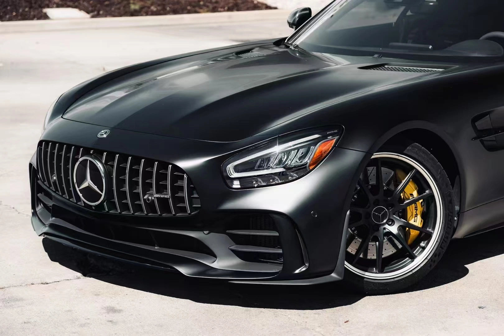 Silky Noir wrap on Mercedes-AMG GT R front-left - detailed view of bumper and grille - Kaleido