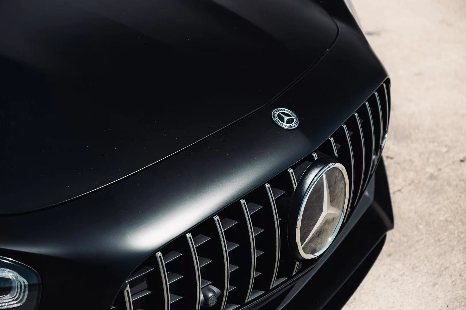 Close-up of Silky Noir matte vinyl on AMG GT R hood - ultra-smooth silk finish - Kaleido