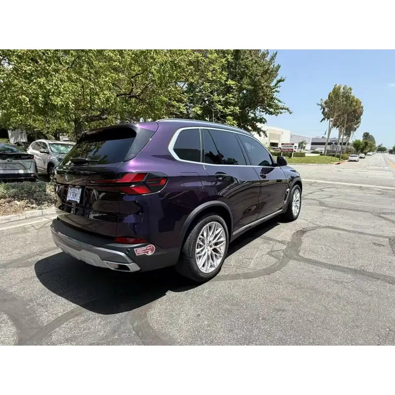 Midnight Purple Metallic wrap, rear-right angle of the luxury BMW X5 SUV - Kaleido