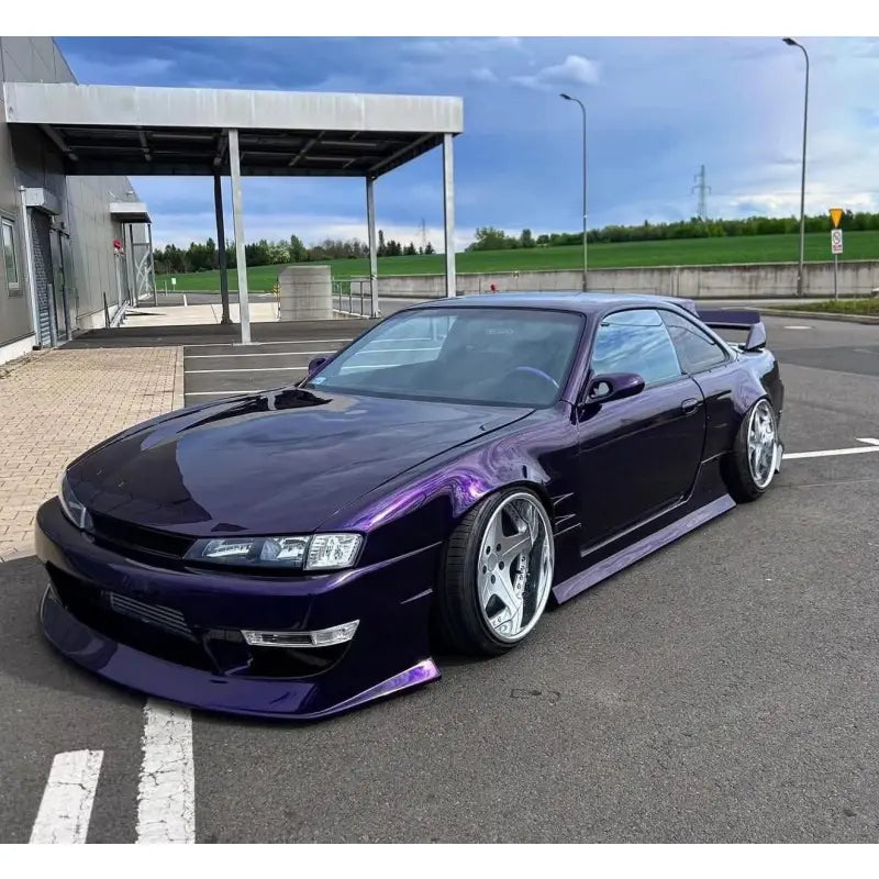 Midnight Purple Metallic vinyl wrap on the front-left angle of a Nissan Silvia S14 - Deep gloss purple JDM tuner car - Kaleido