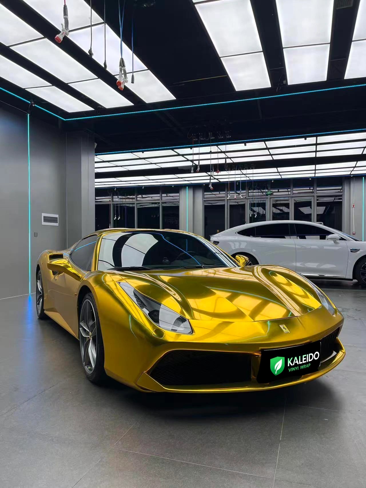 Low front-right angle of a Ferrari 488 GTB in Mirror Chrome Gold - highlighting mirror finish - Kaleido