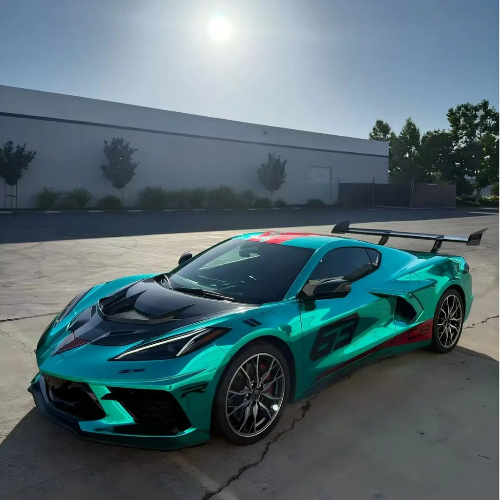 Wide front-left view of Corvette C8 in Mirror Chrome Green - outdoor natural lighting - Kaleido