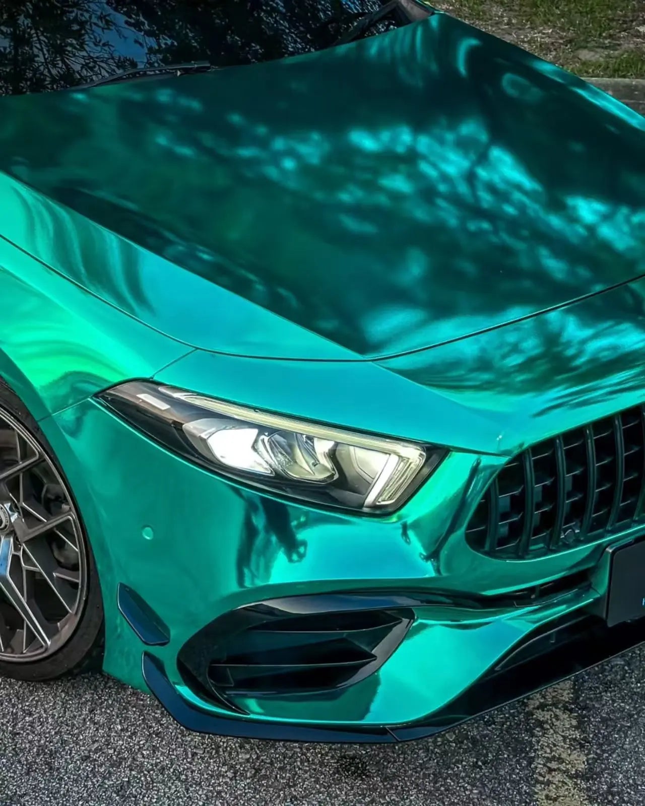 Mirror Chrome Green vinyl on Mercedes-AMG A45 front-right - highlighting sporty bumper - Kaleido