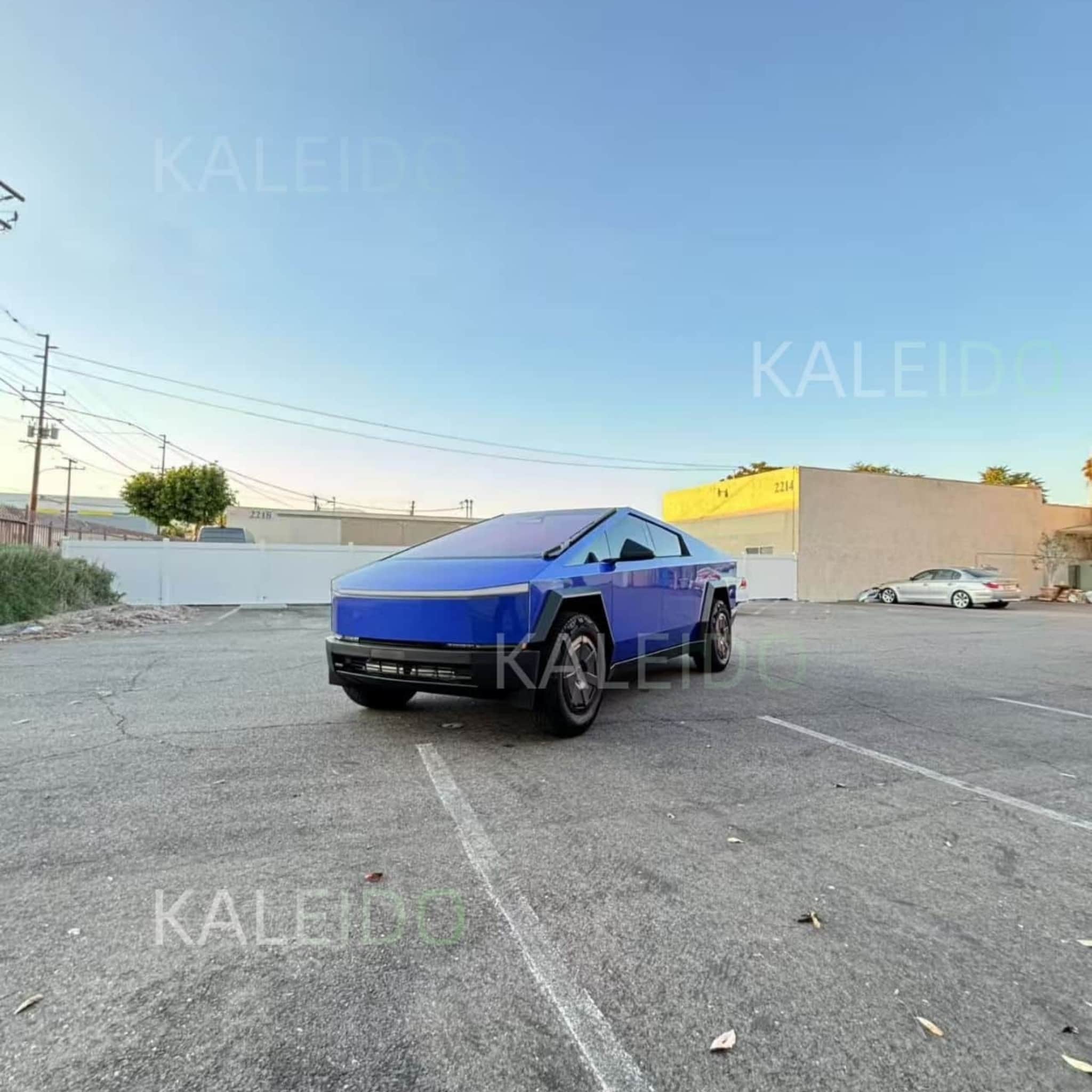 Hero shot of a Tesla Cybertruck fully wrapped in Portimao Blue Metallic, showcasing its unique shape and color - Kaleido