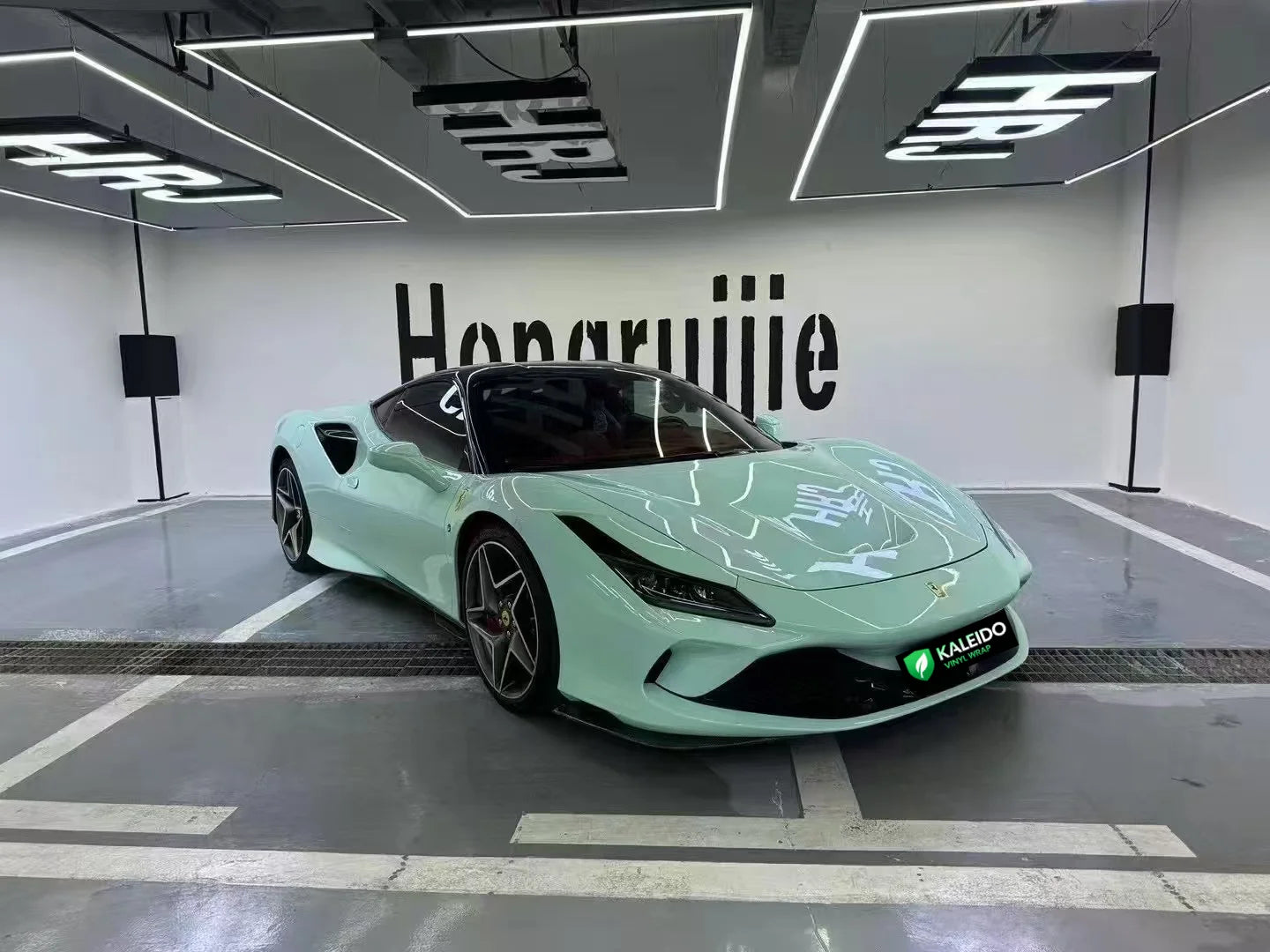 Close-up of the front-right corner on a Ferrari F8 Tributo in Rolls-Royce Sagano Green - Kaleido