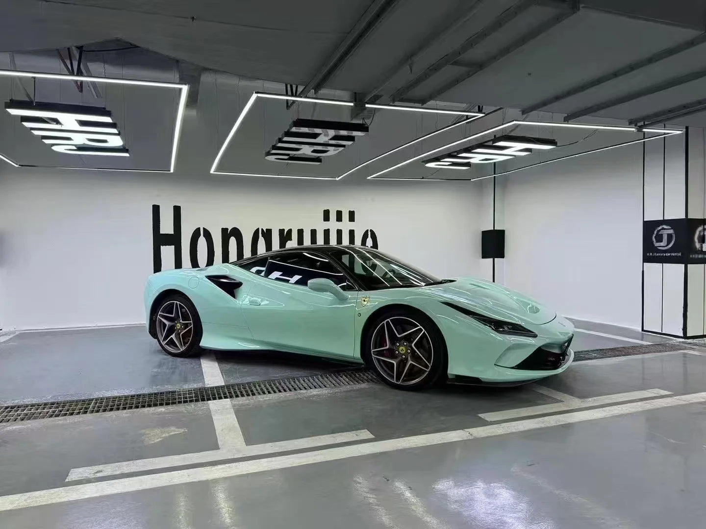 Wide right side panoramic view of a Rolls-Royce Sagano Green wrapped Ferrari F8 Tributo - Kaleido