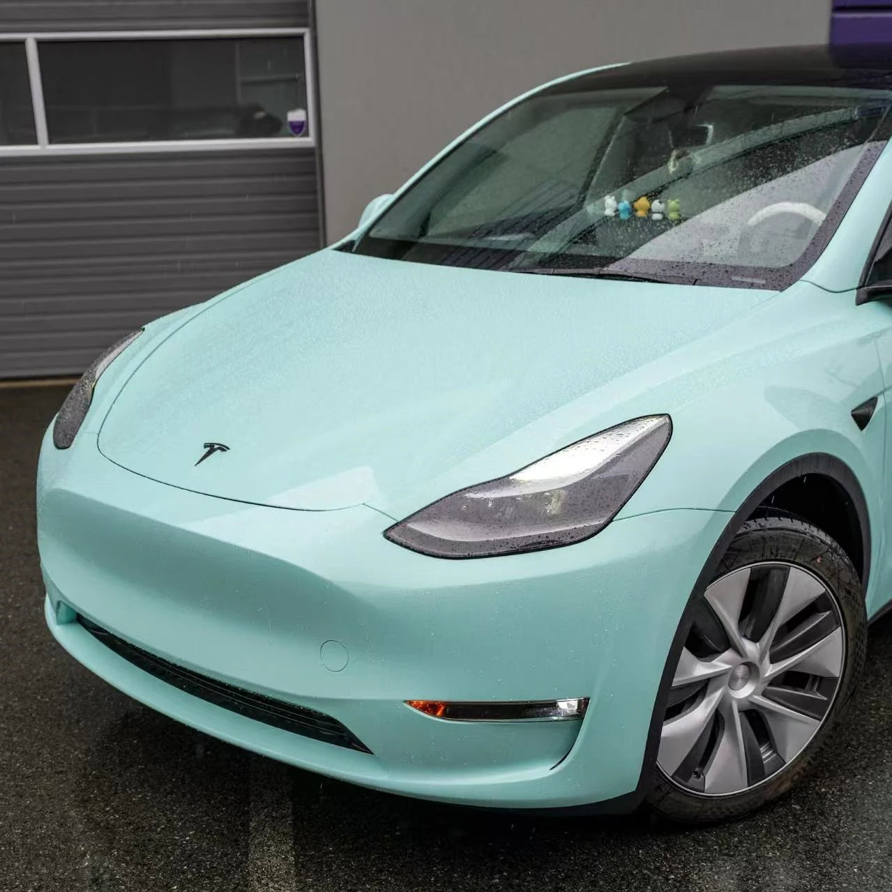 Close-up front-left detail of Rolls-Royce Sagano Green film on Tesla Model Y - Kaleido