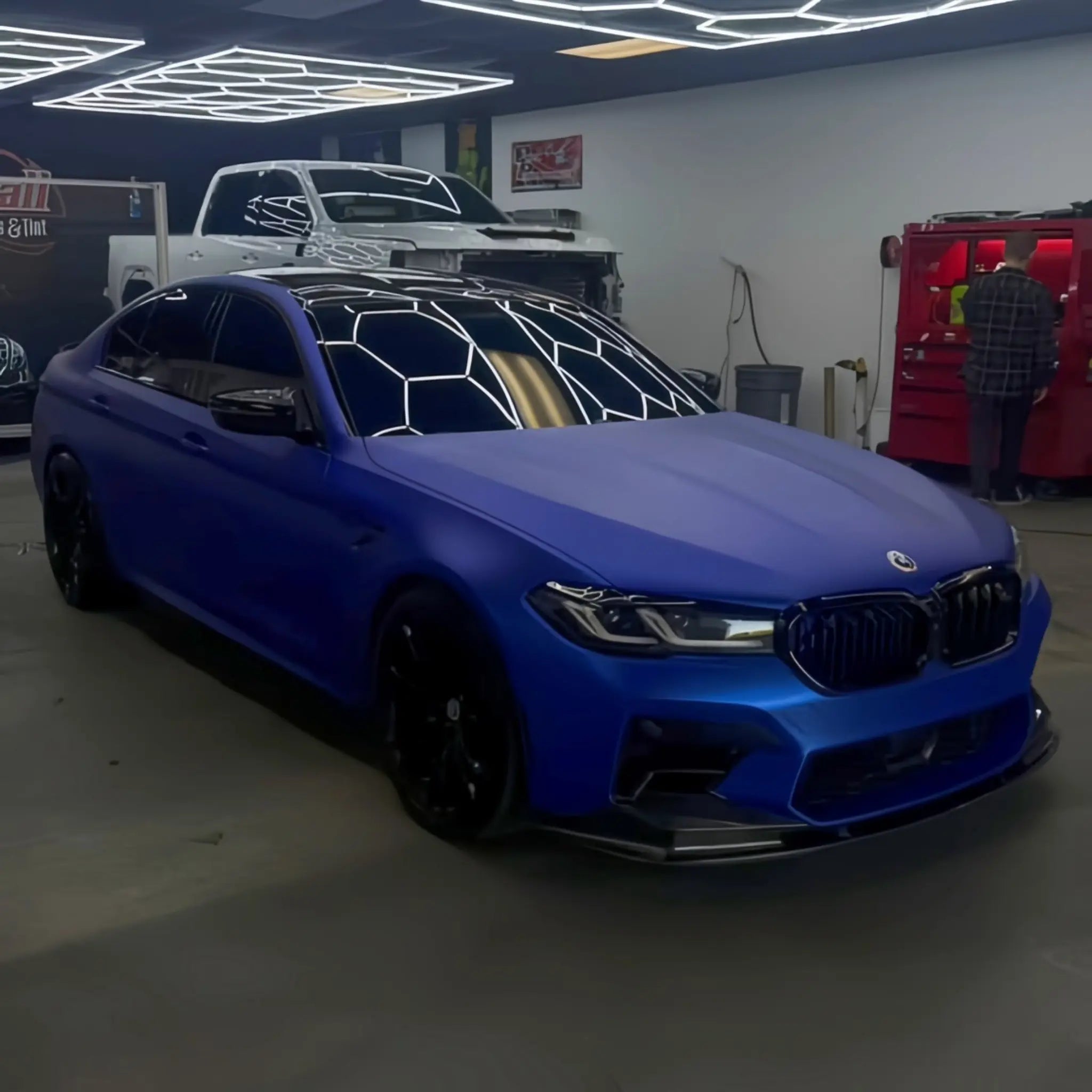 BMW M5 in Satin Chrome Abyss Blue vinyl - front-right angle showing matte chrome depth - Kaleido