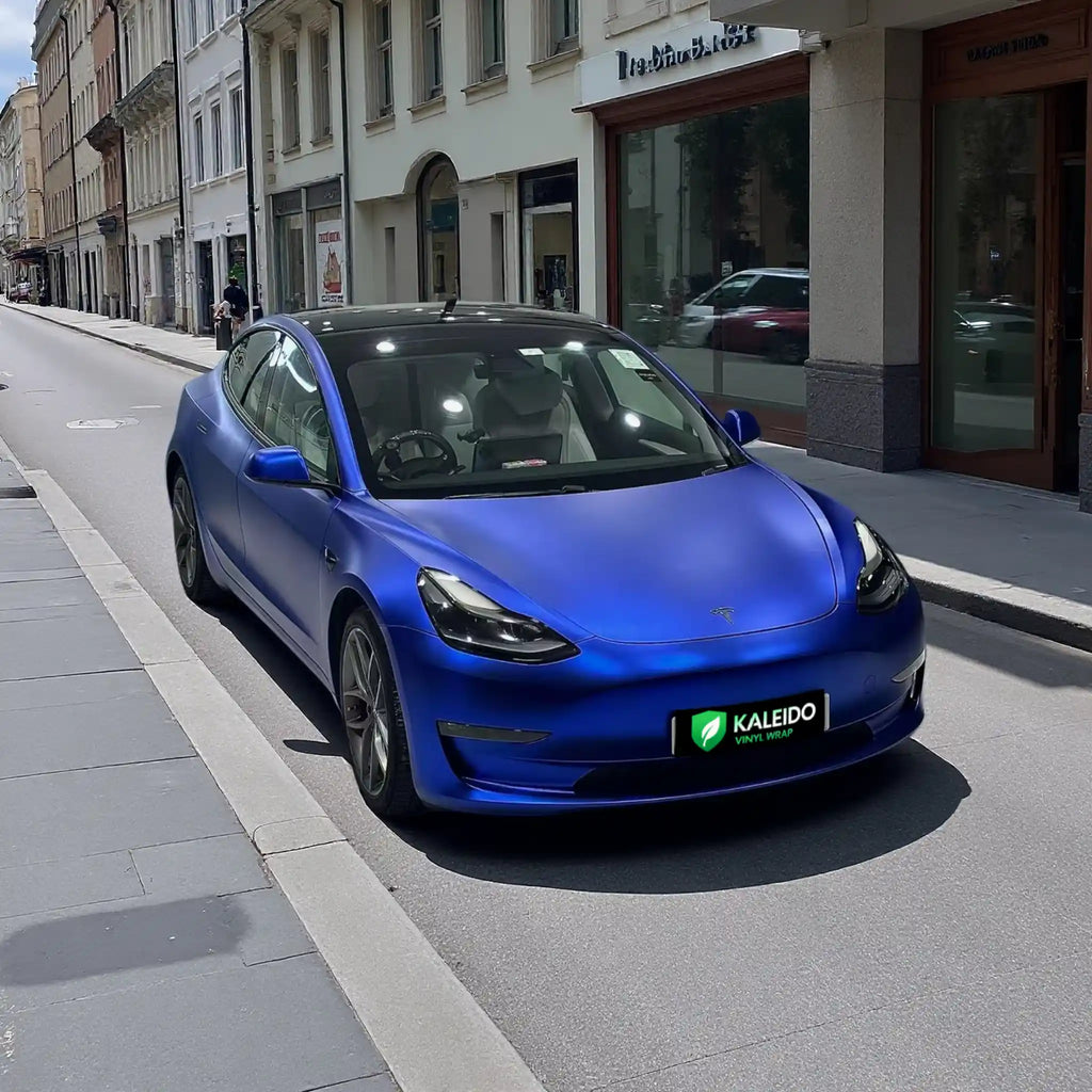 Tesla Model 3 with Satin Chrome Abyss Blue film - outdoor front-right view in natural light - Kaleido
