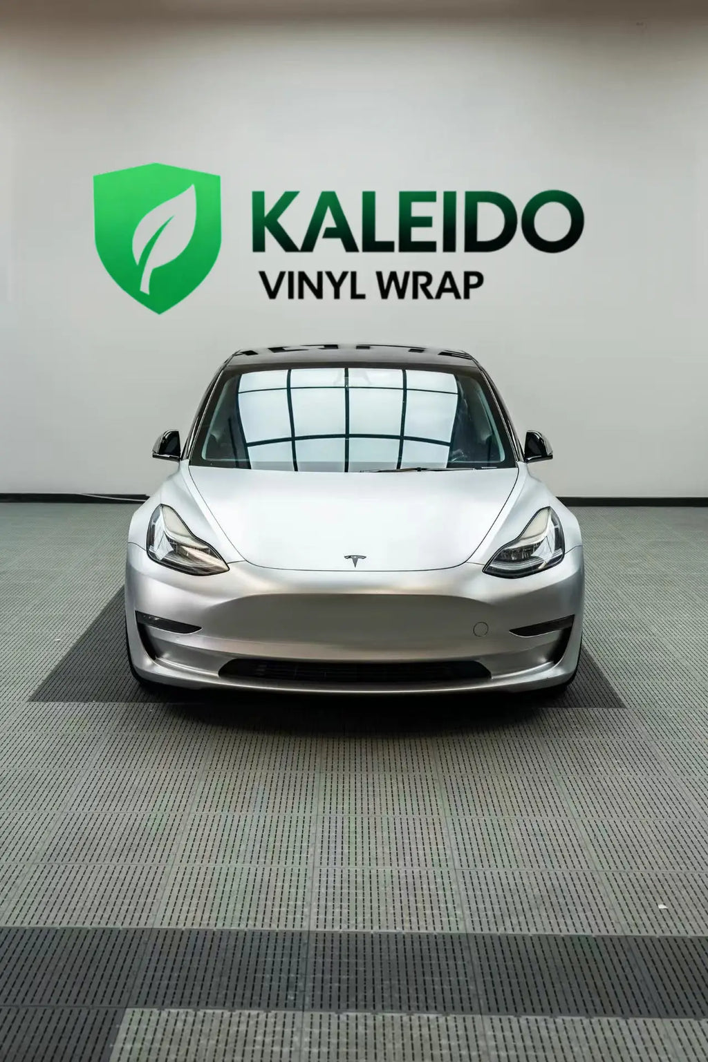 Top-down front view of a Tesla Model 3 in Satin Chrome Alexander Silver wrap - showing hood and roof - Kaleido
