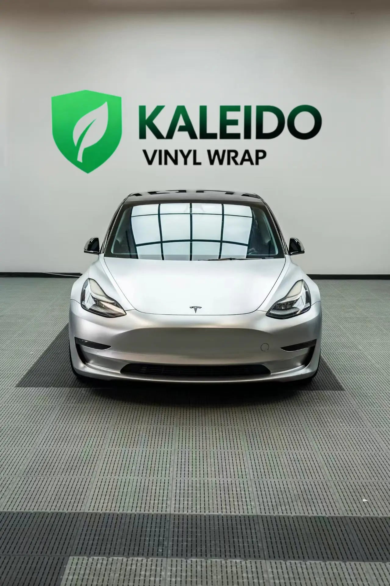 Top-down front view of a Tesla Model 3 in Satin Chrome Alexander Silver wrap - showing hood and roof - Kaleido