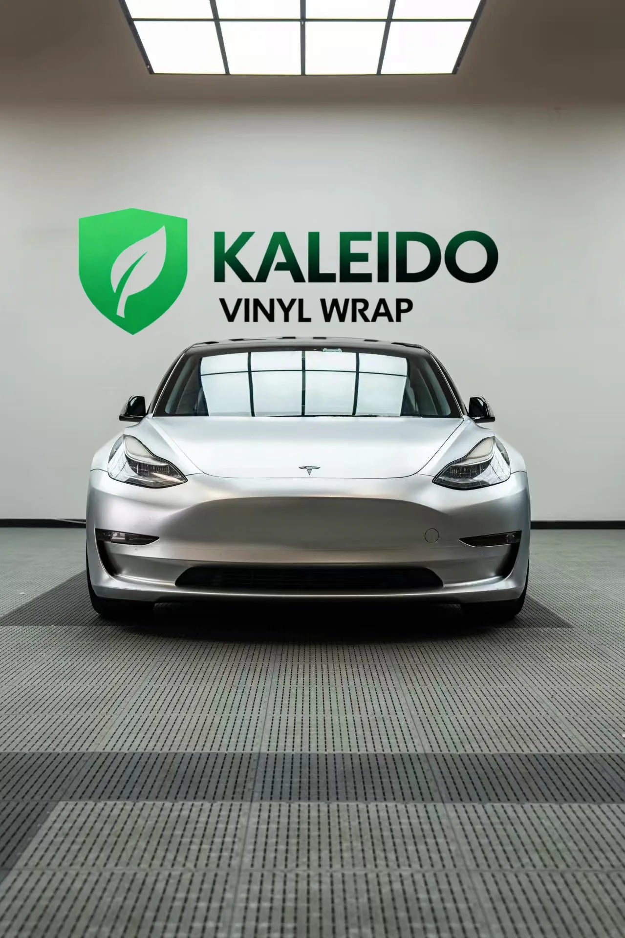 Front view of a Tesla Model 3 with Satin Chrome Alexander Silver vinyl - showcasing the modern front fascia - Kaleido