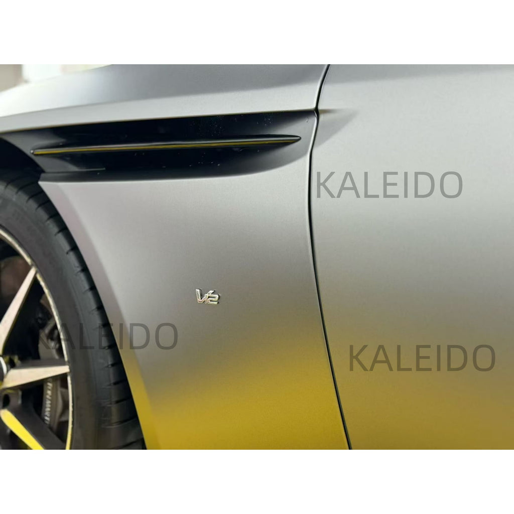 Front-left quarter panel of the Aston Martin DB11 showcasing the AMG Selenite Grey wrap - Kaleido