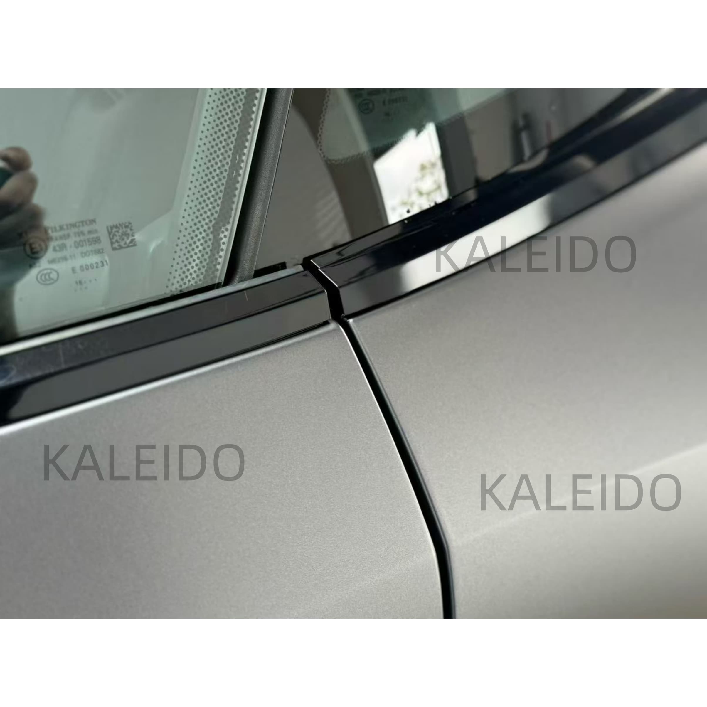 Macro detail showing the satin texture and metallic flakes on the Aston Martin DB11 - Kaleido