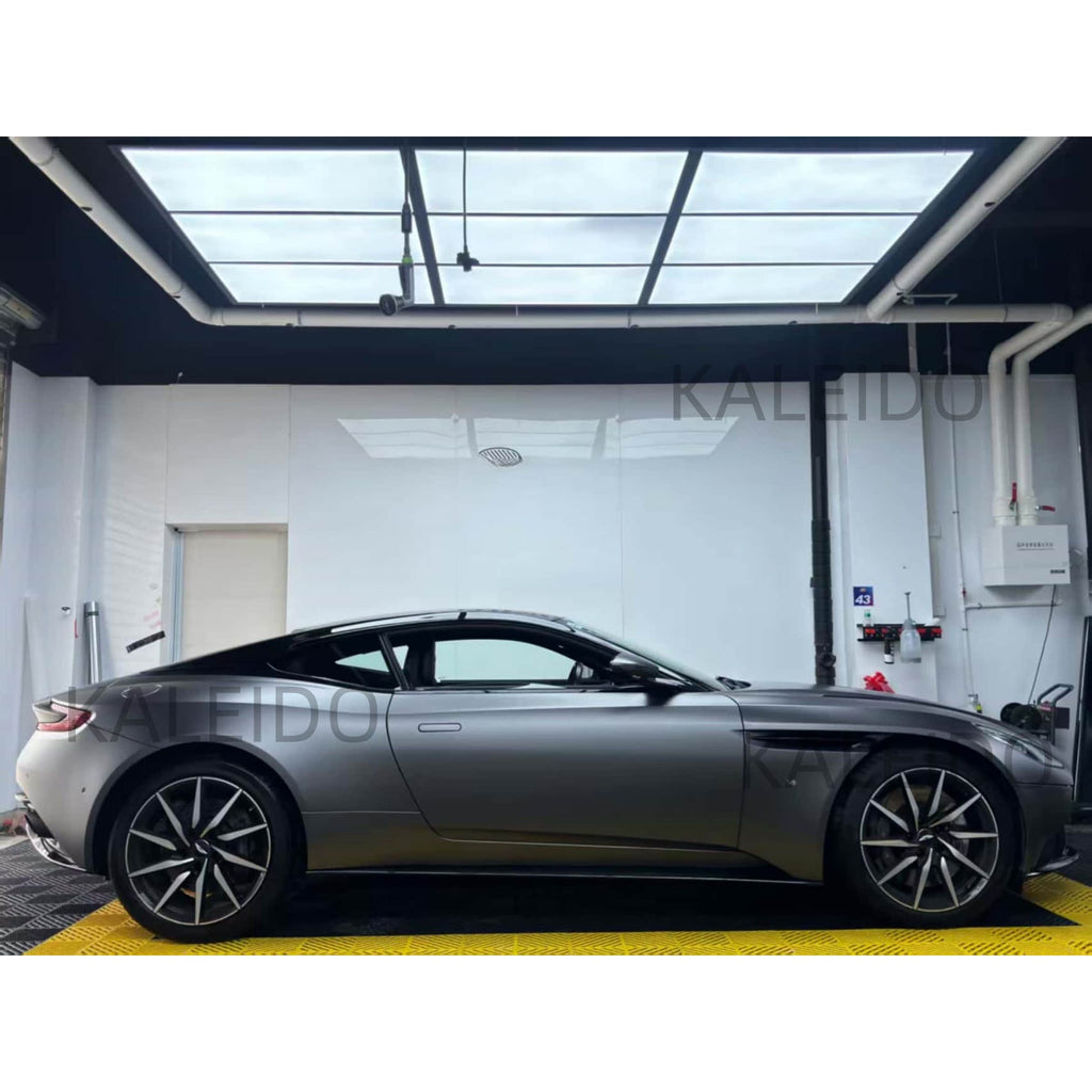 Elegant side profile of the Aston Martin DB11 with AMG Selenite Grey satin chrome film - Kaleido