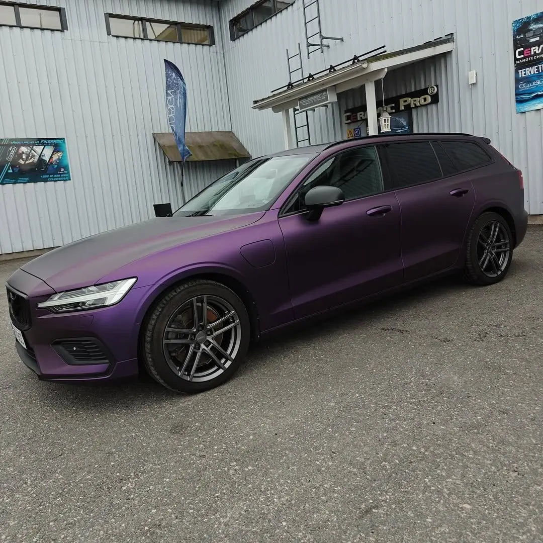 Volvo V60 wagon with Satin Chrome Black Purple film - front-left angle - Kaleido