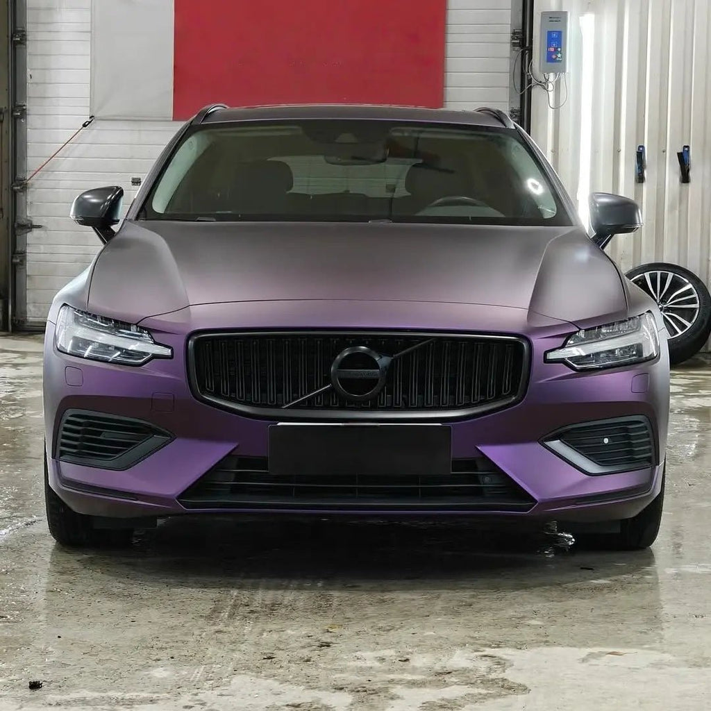 Front view of a Volvo V60 wagon in Satin Chrome Black Purple vinyl wrap - Kaleido