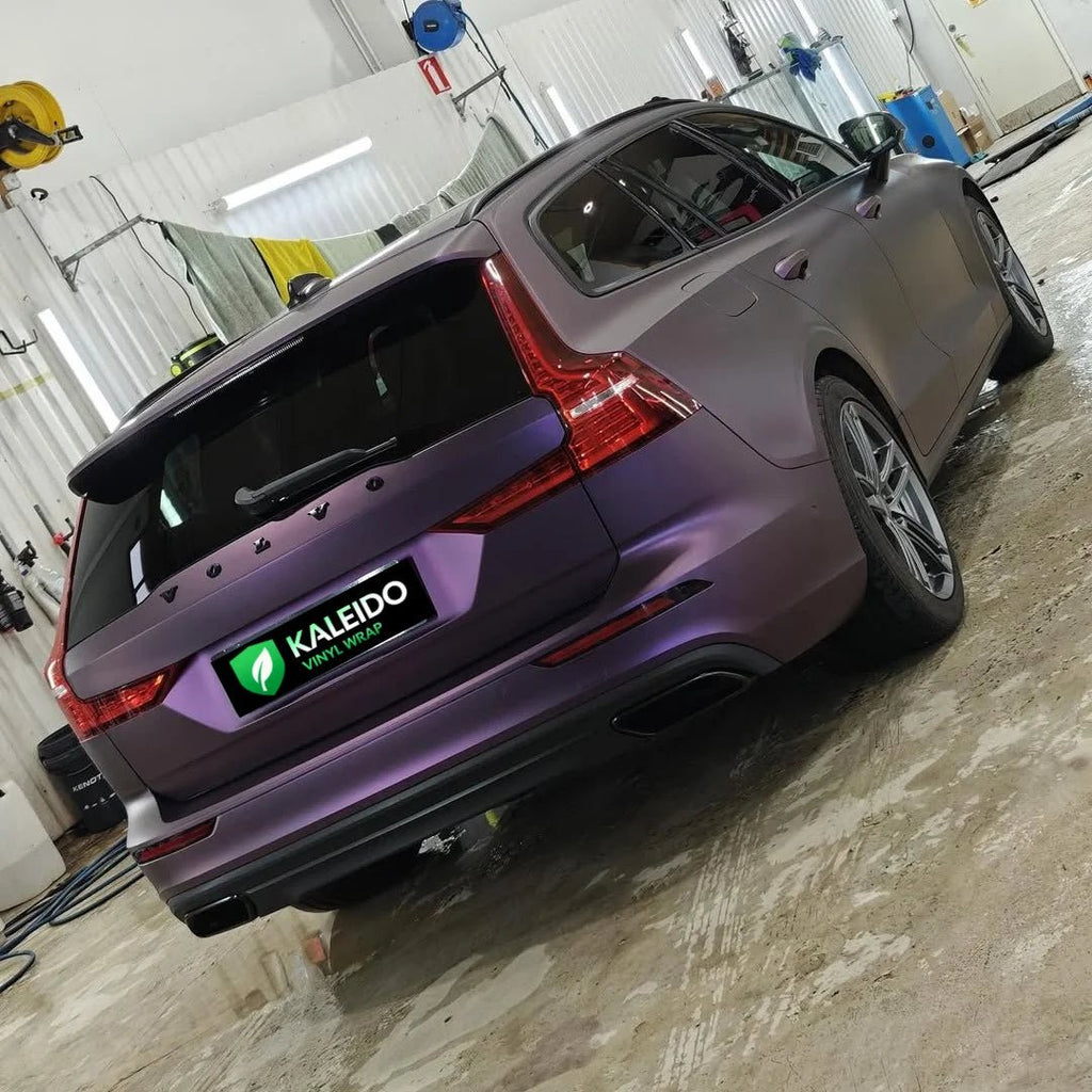 Rear-right view of a Satin Chrome Black Purple wrapped Volvo V60 wagon - Kaleido