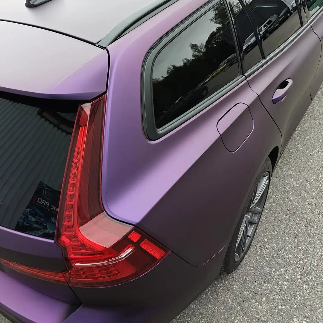 Detailed shot of the Satin Chrome Black Purple finish on the Volvo V60 wagon's rear-right quarter panel - Kaleido