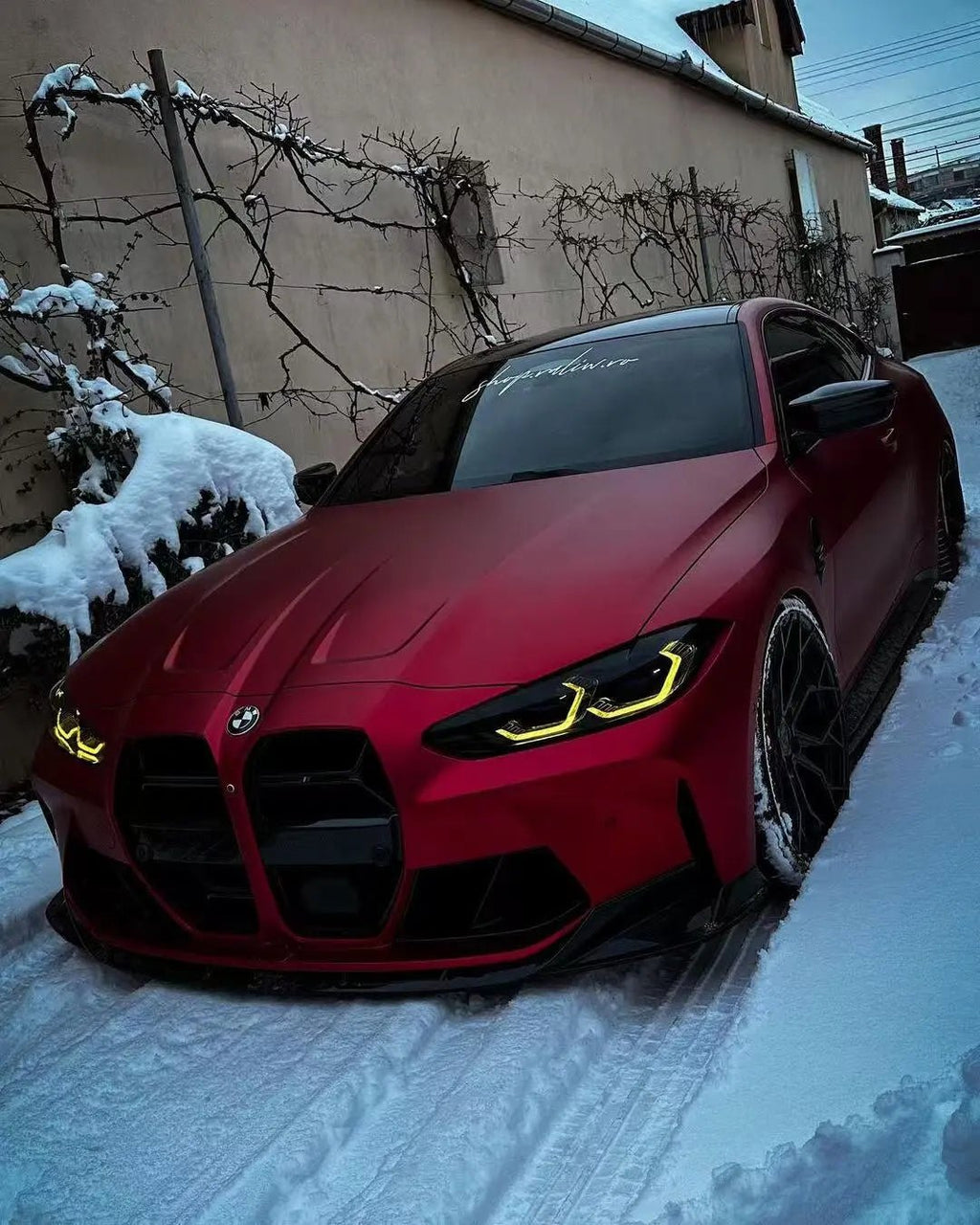 Wide front-left view of BMW M3 in Satin Chrome Romanee Red matte chrome wrap - Kaleido