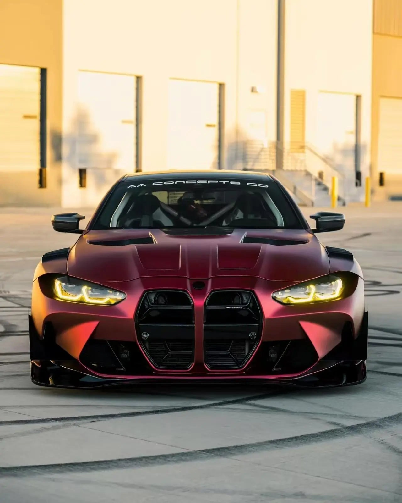 BMW M4 in Satin Chrome Romanee Red - front view showing matte metallic finish - Kaleido