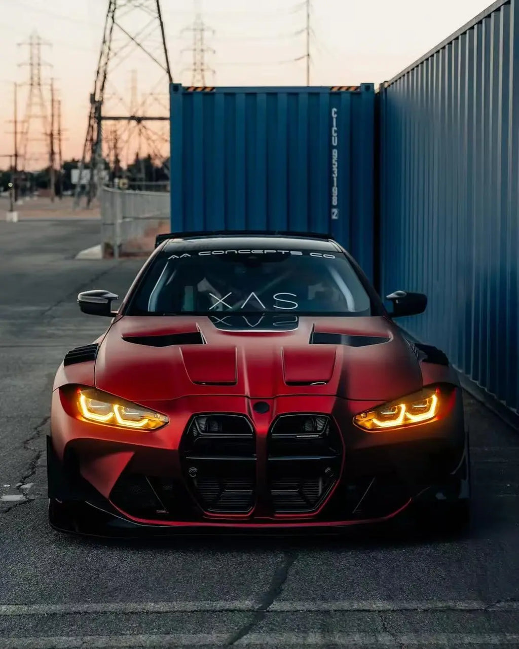 Front view of BMW M4 with Satin Chrome Romanee Red matte chrome film - Kaleido
