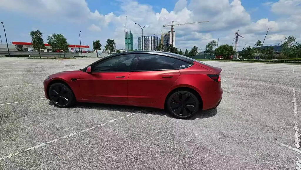 Full side profile of Tesla Model 3 wrapped in Satin Chrome Romanee Red matte metallic film - Kaleido