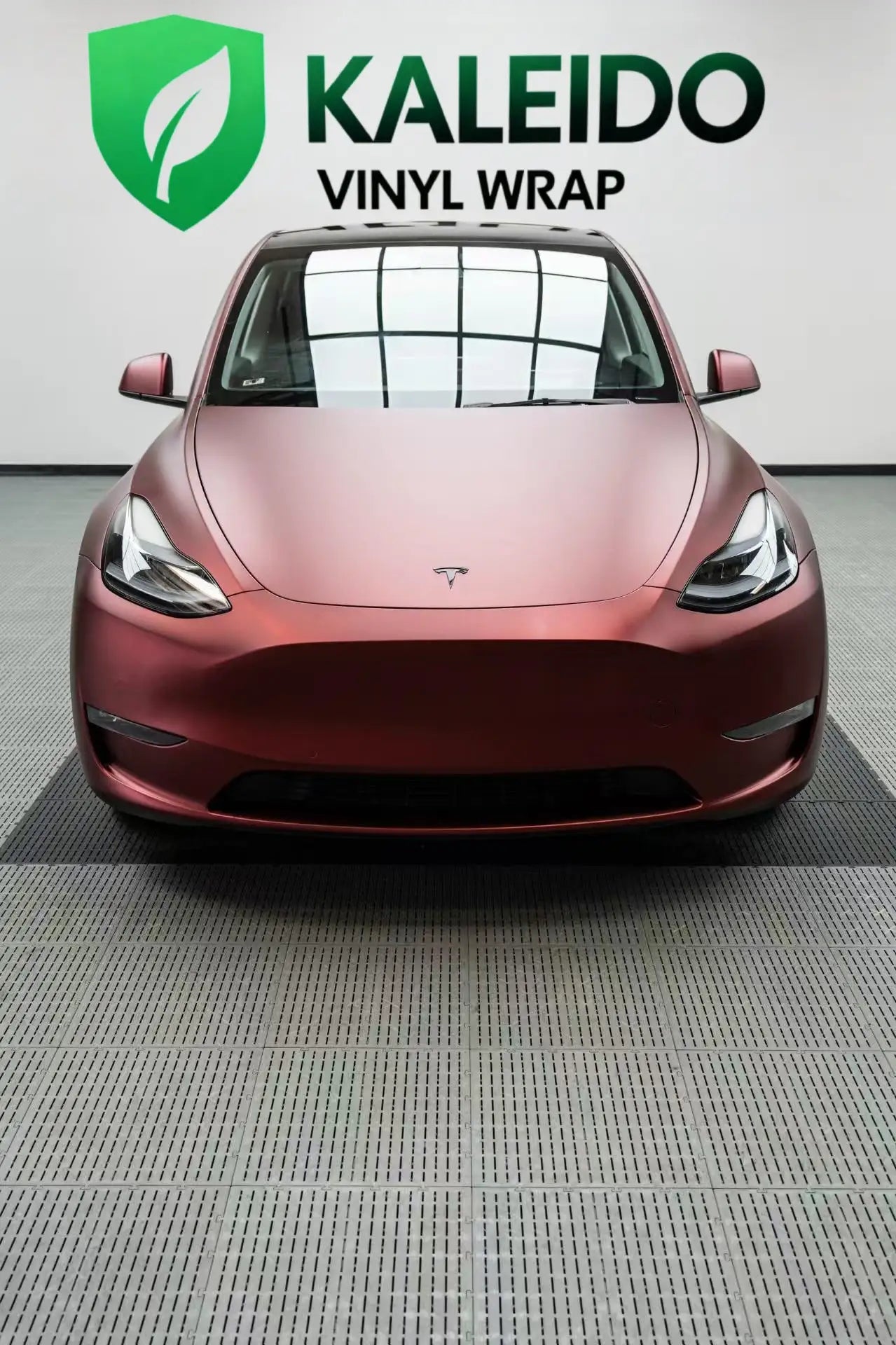 Top-down front view of Tesla Model Y in Satin Chrome Silk Red - showing hood and fenders - Kaleido
